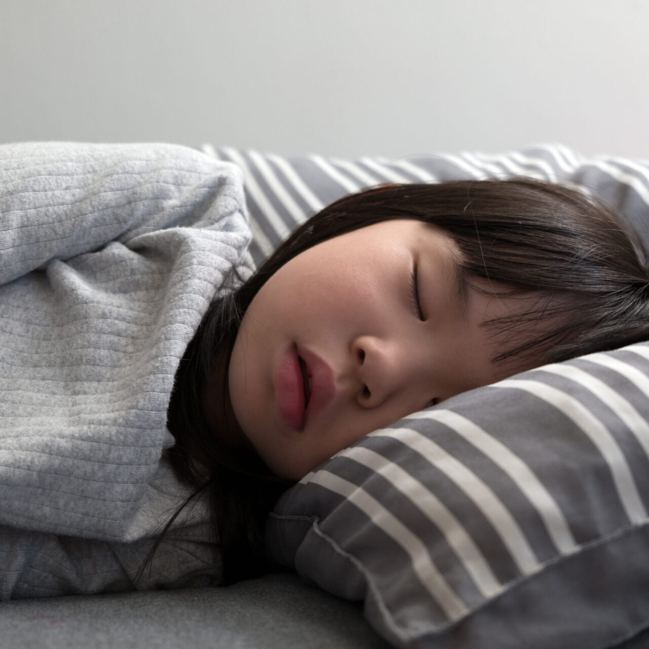 Child girl sleeping on bed Airway Treatments