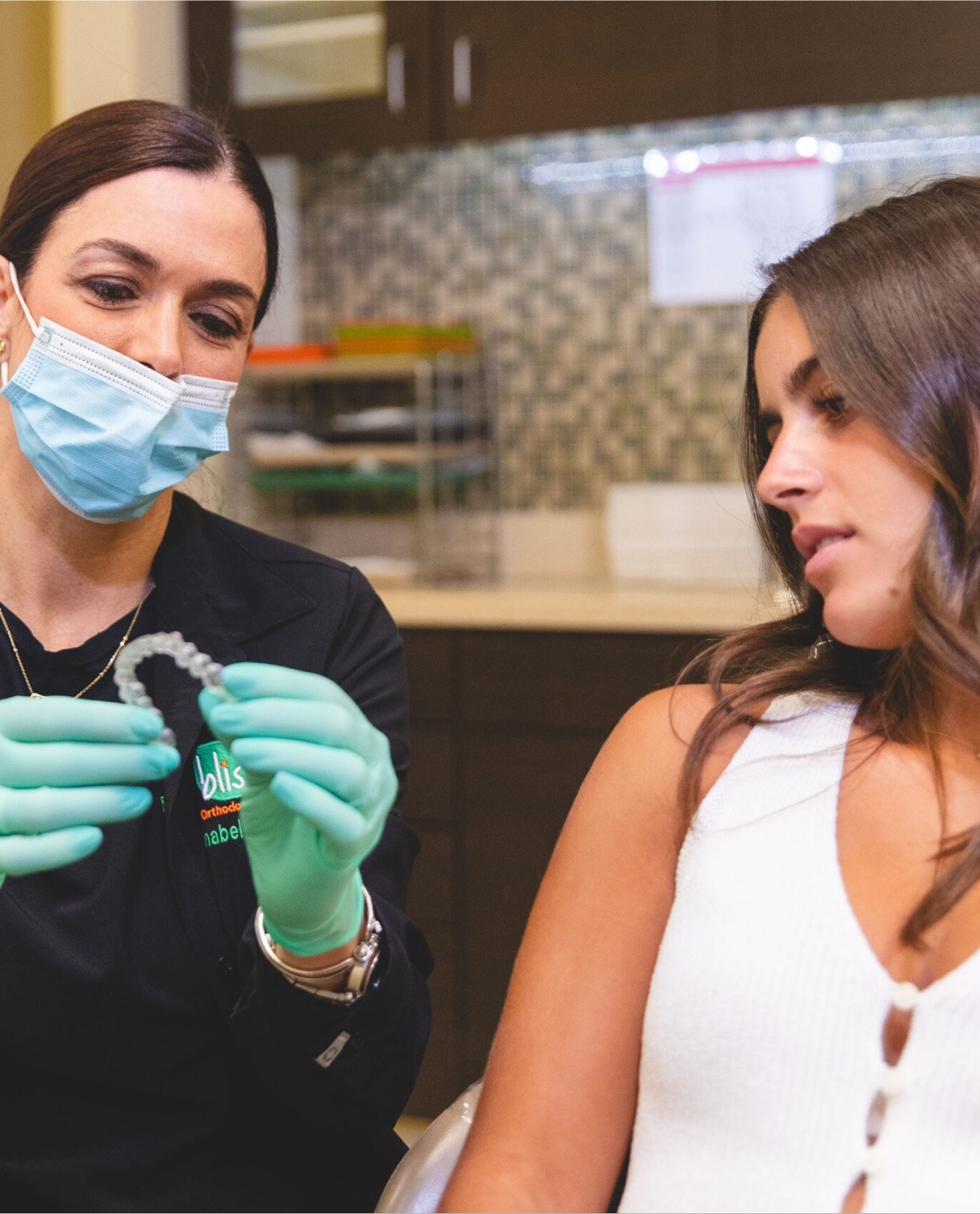 dr.henao hugging patient during orthodontic visit